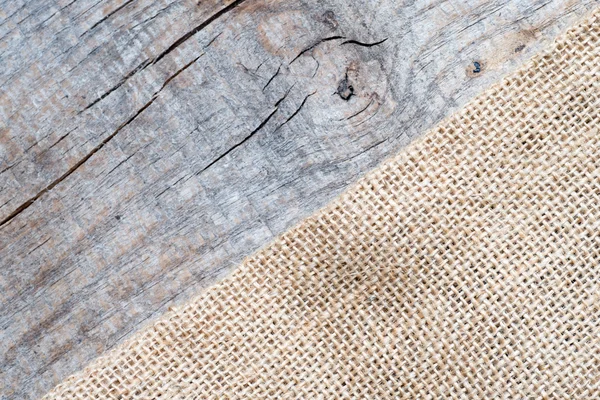 Textura de arpillera sobre mesa de madera —  Fotos de Stock