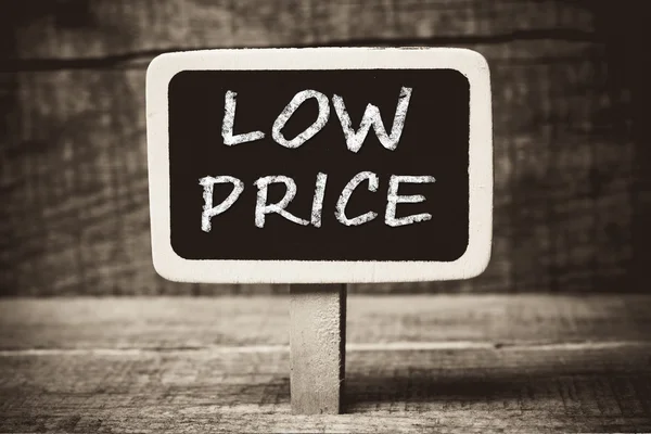 Low price handwritten with white chalk on a blackboard — Stock Photo, Image