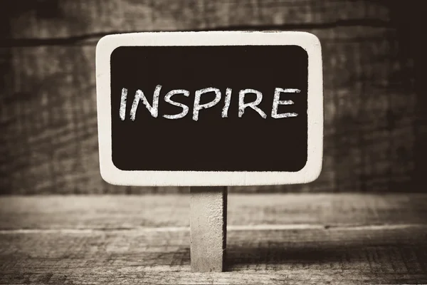 Inspire handwritten on blackboard — Stock Photo, Image