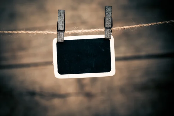 Old photo postcard and clothes peg on wood — Stock Photo, Image