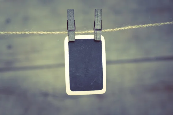 Old photo postcard and clothes peg on wood — Stock Photo, Image