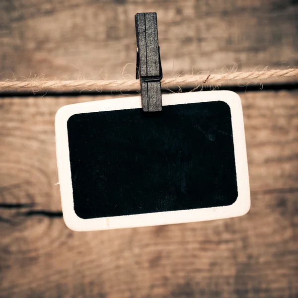 Old photo postcard and clothes peg on wood — Stock Photo, Image