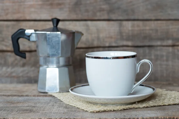 Cup of coffee and coffe maker — Stock Photo, Image
