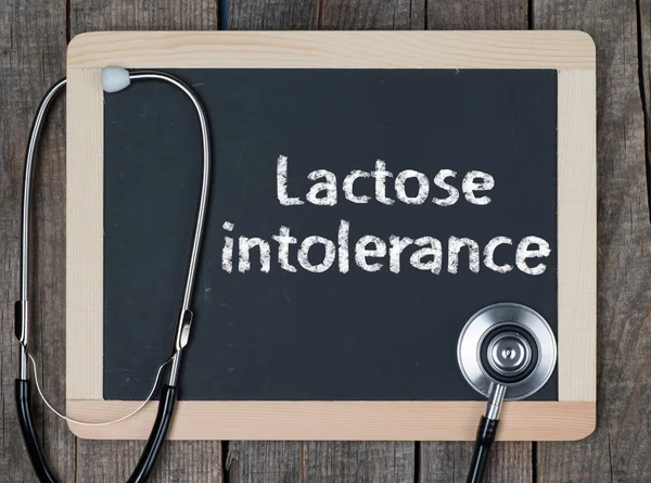 Blackboard with word Lactoseintolerance and stethoscope — Stock Photo, Image