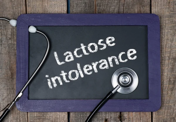 A word lactoseintolerance és sztetoszkóp tábla — Stock Fotó