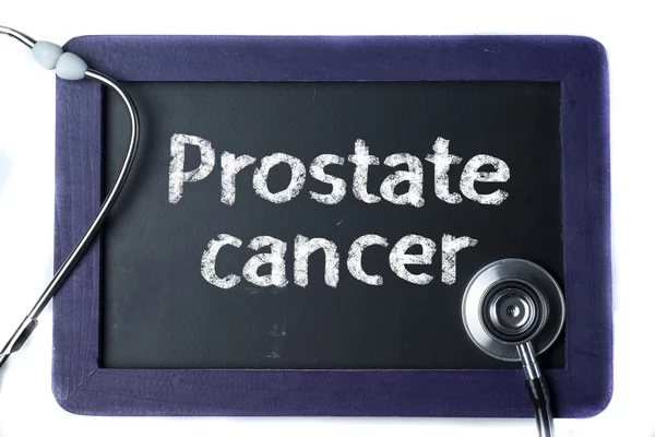 Tavlan med ordet prostatacancer och stetoskop — Stockfoto