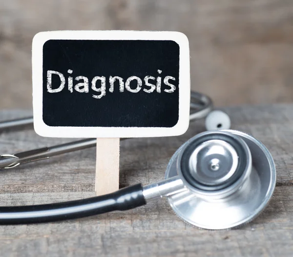 Blackboard with word Diagnosis and stethoscope — Stock Photo, Image