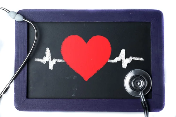 Sfondo texture in legno con stetoscopio e simbolo del cuore — Foto Stock