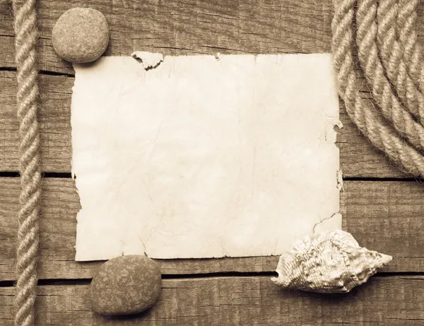 Ship rope, sea shells, notebook and old wood background — Stock Photo, Image