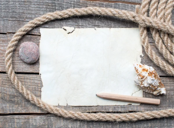 Ship rope, sea shells, notebook and old wood background — Stock Photo, Image