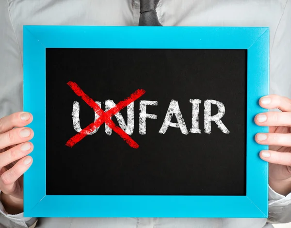 Unfair-fair — Stockfoto