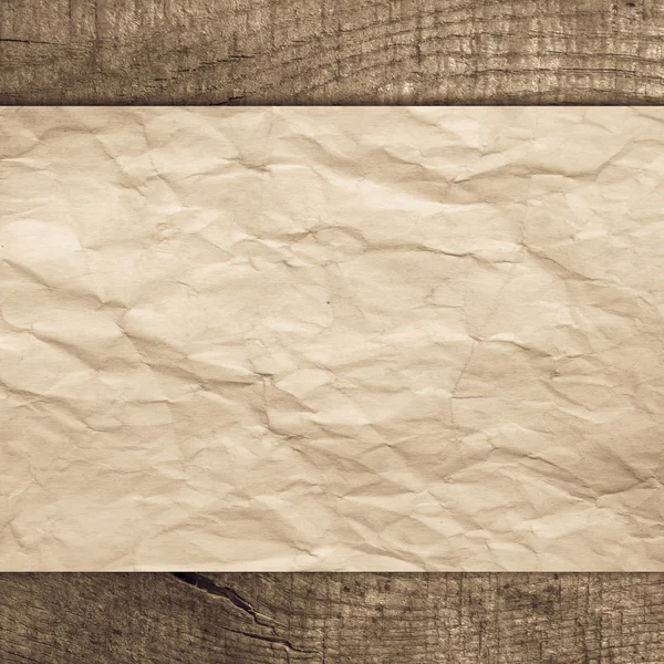 Vieux papier sur fond en bois — Photo