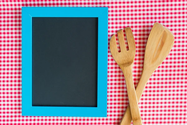 Menu blackboard with wooden spoon and fork — Stock Photo, Image