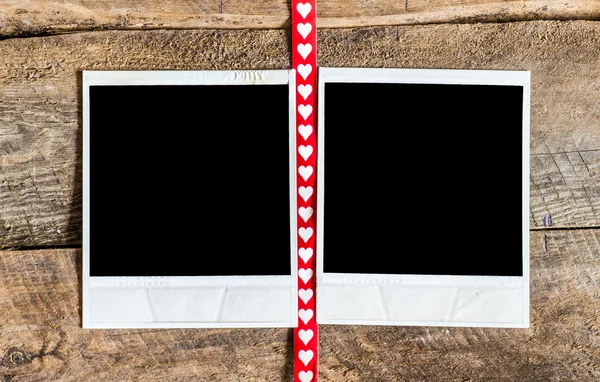 Two photo frames and small red  heart ribbon — Stock Photo, Image