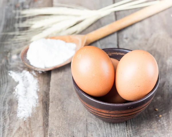 Flour, eggs, and cooking utensils — Stock Photo, Image