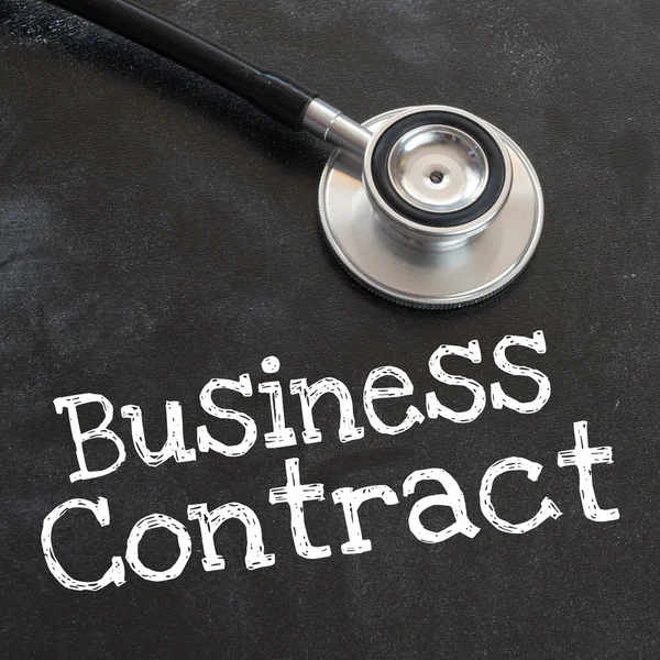 Stethoscope and business contract — Stock Photo, Image