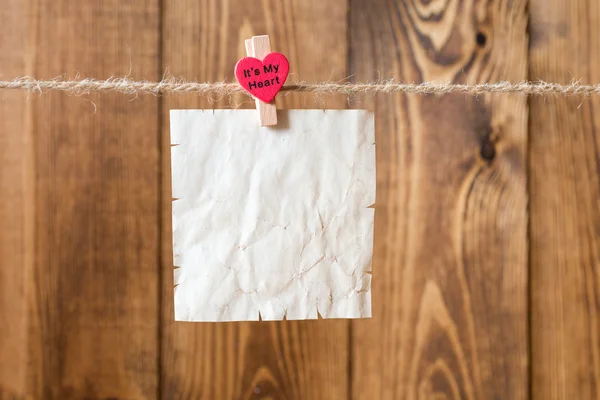 Old paper on brown wood texture — Stock Photo, Image