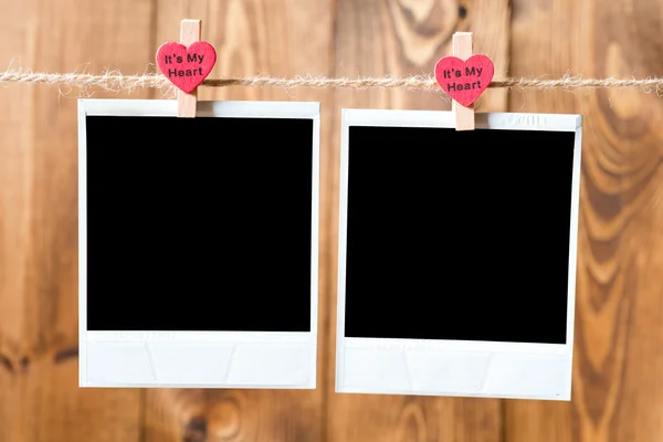 Old picture frame hanging on clothesline — Stock Photo, Image