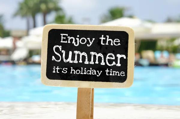 Enjoy the summer it's holiday time handwritten on blackboard — Stock Photo, Image