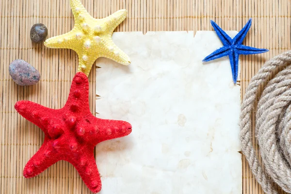 Starfishes y hoja de papel —  Fotos de Stock