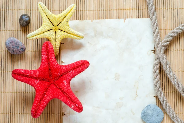 Starfishes and paper sheet — Stock Photo, Image