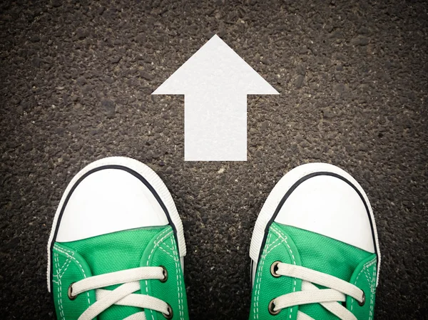 Sneakers on asphalt — Stock Photo, Image