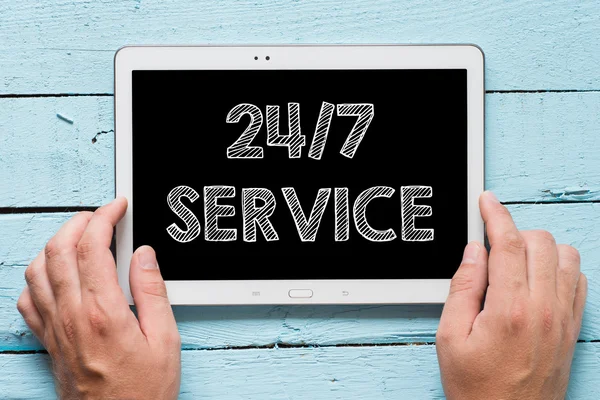 Tablet PC with words 24-7 service — Stock Photo, Image