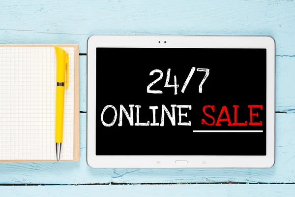 Tablet PC with words 24-7 online sale — Stock Photo, Image