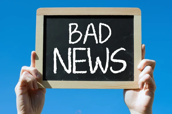 Chalkboard with text bad news Stock Photo