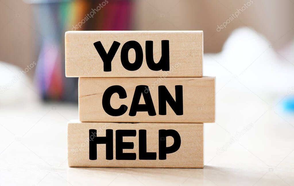 YOU CAN HELP words on wooden blocks.