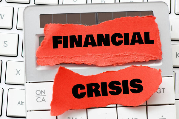 FINANCIAL CRISIS words on little red sheets of paper,