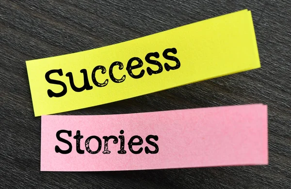 Success Stories Words Small Sheets Paper Black Background — Stock Photo, Image