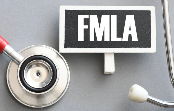 FMLA Family Medical Leave Act. FMLA words on the chalk board.