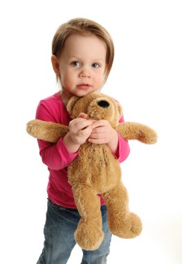 Scared girl holding a teddy bear clipart