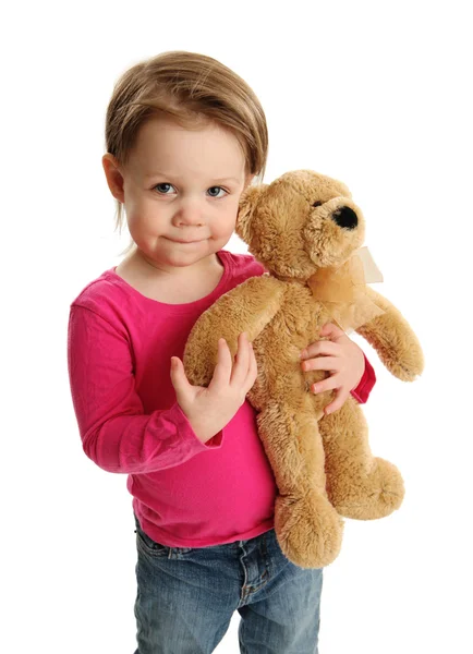 Niño pequeño sosteniendo un oso de peluche —  Fotos de Stock