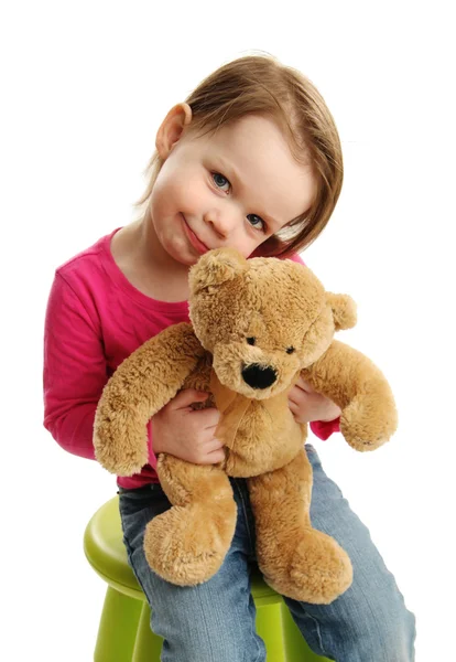 Sweet girl holding a teddy bear — Stock Photo, Image