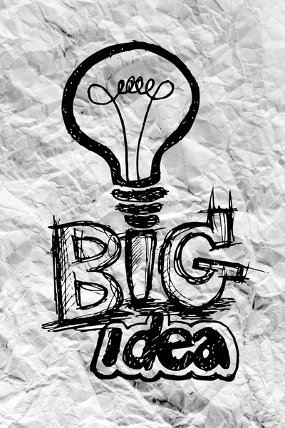 Idea concept light bulb on crumpled paper — Stock Photo, Image