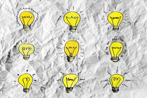 Idea concept light bulb on crumpled paper — Stock Photo, Image