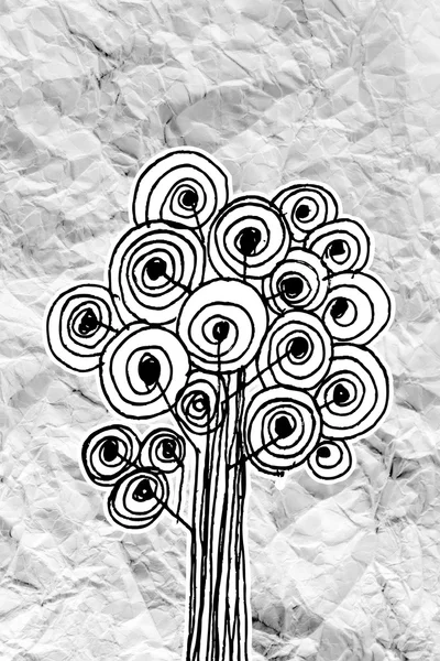 Aantal bomen met bladeren op verfrommeld papier — Stockfoto