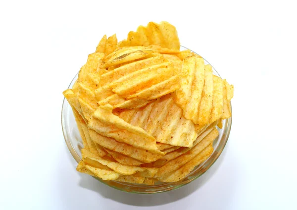 Delicious potato chips in bowl on a white background — Stock Photo, Image