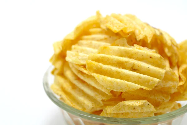 Delicious potato chips in bowl on a white background — Stock Photo, Image