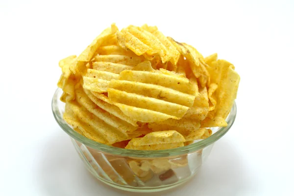 Delicious potato chips in bowl on a white background — Stock Photo, Image