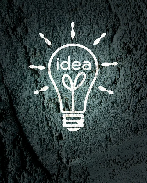 Idea Icono de bombilla en la pared textura fondo diseño — Foto de Stock