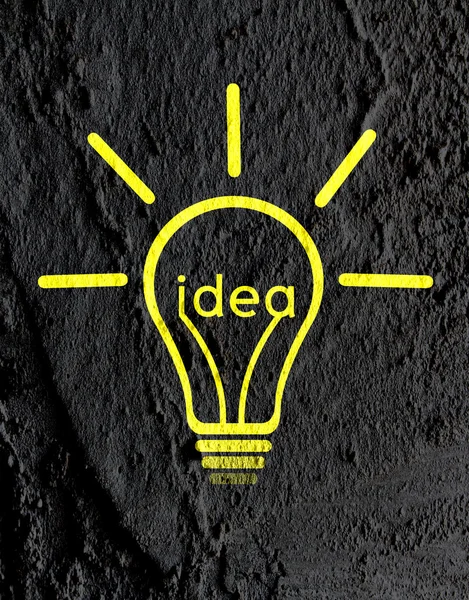 Idea Light bulb icon on wall texture background design — Stock Photo, Image