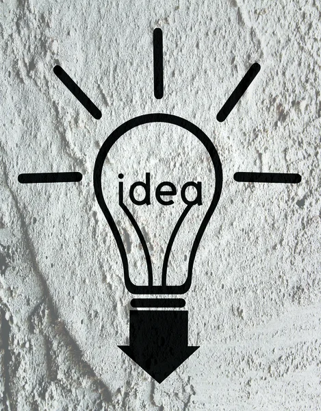 Idea Light bulb icon on wall texture background design — Stock Photo, Image