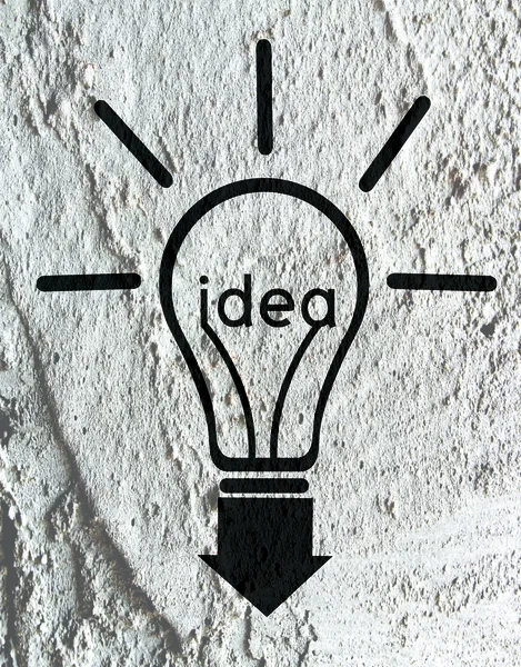 Idea Light bulb icon on wall texture background design — Stock Photo, Image