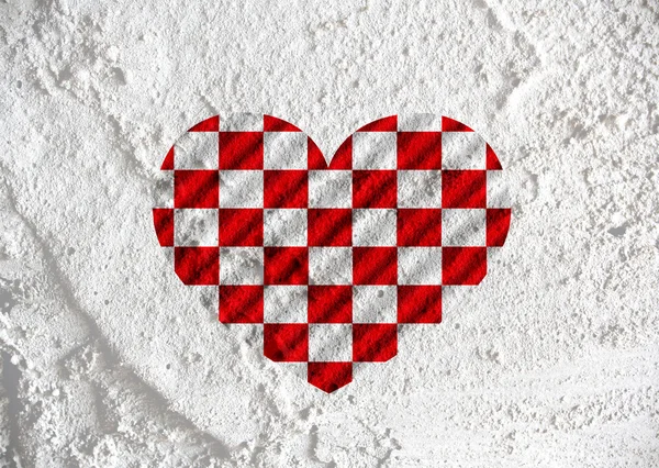 Amor a cuadros signo de la bandera símbolo del corazón en la pared de cemento textura ba —  Fotos de Stock