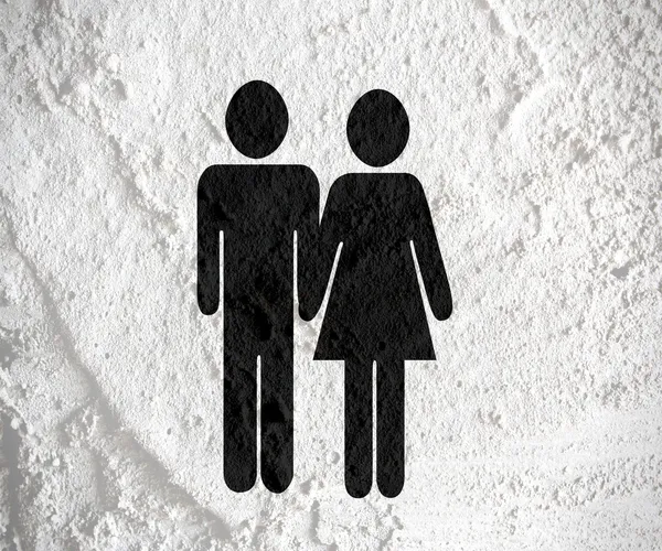 Piktogram adam kadın işareti simgelerini çimento duvar dokusu zemin üzerine — Stok fotoğraf