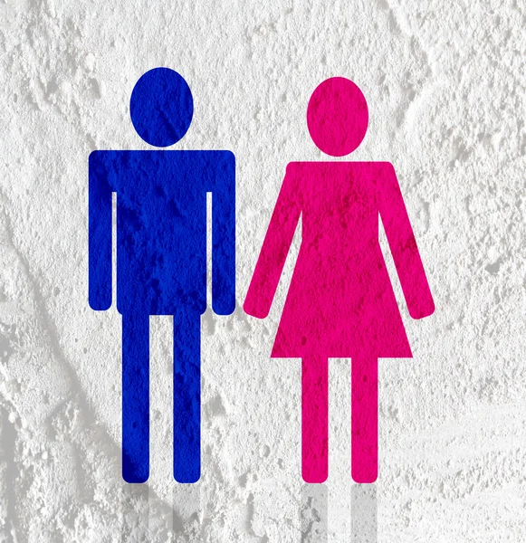 Pictogram man vrouw teken pictogrammen op cement muur textuur achtergrond — Stockfoto