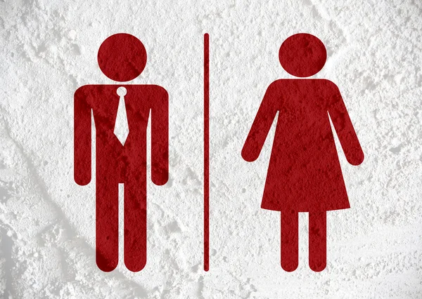 トイレのアイコンとピクトグラム男性女性サインオン セメント壁テクスチャ — ストック写真